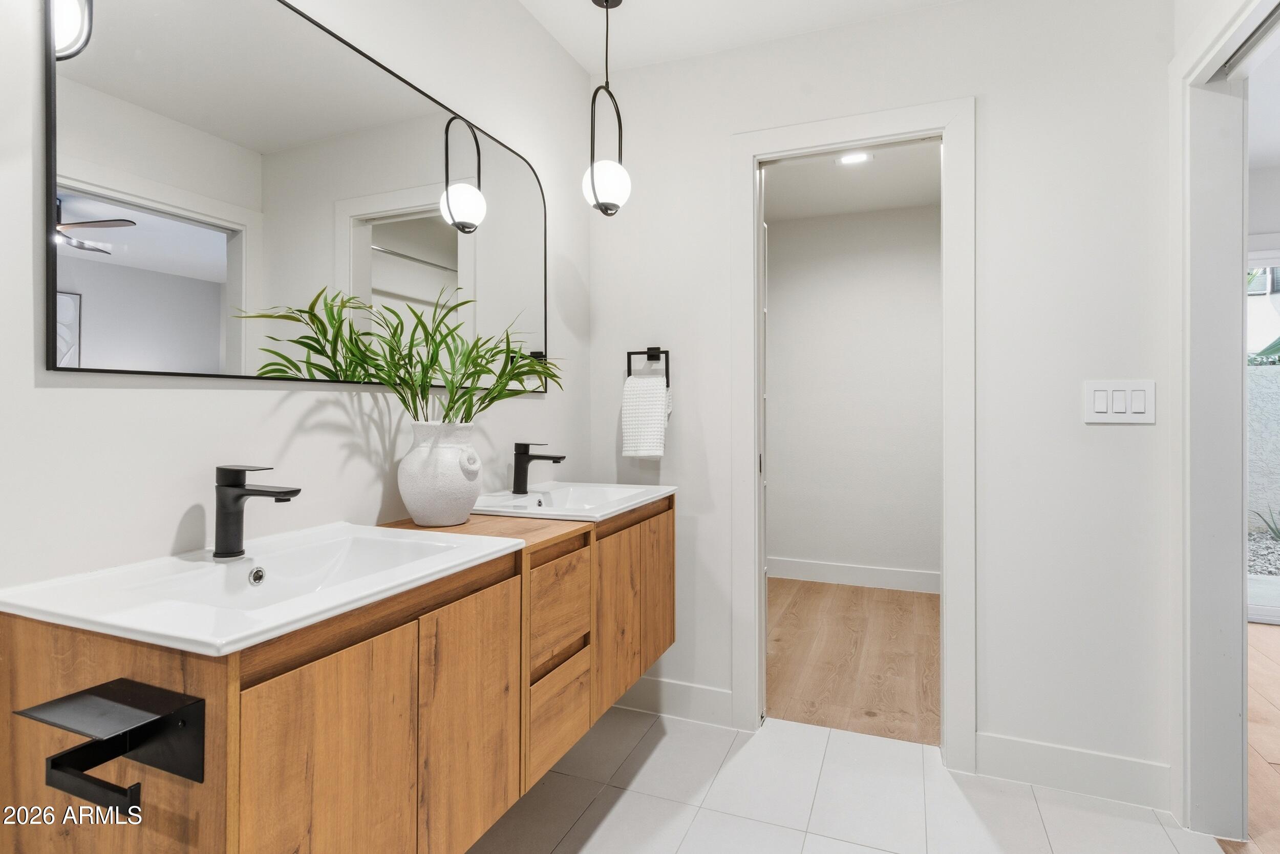 3415 North 36th Street, Unit 3 Phoenix, AZ 85018 - Photo 17 of 33 a bathroom with a sink and a mirror