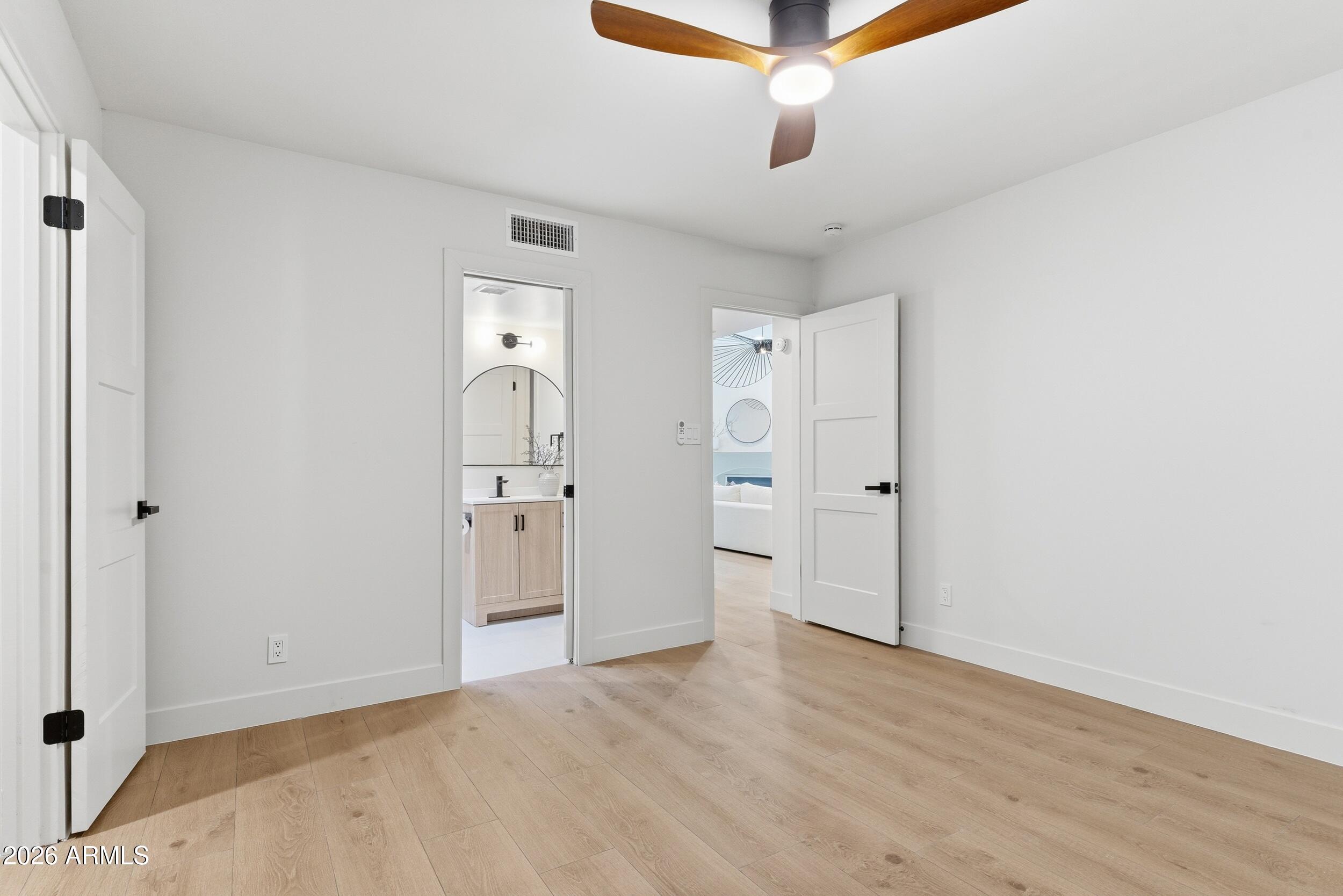 3415 North 36th Street, Unit 3 Phoenix, AZ 85018 - Photo 22 of 33 a view of empty room with wooden floor