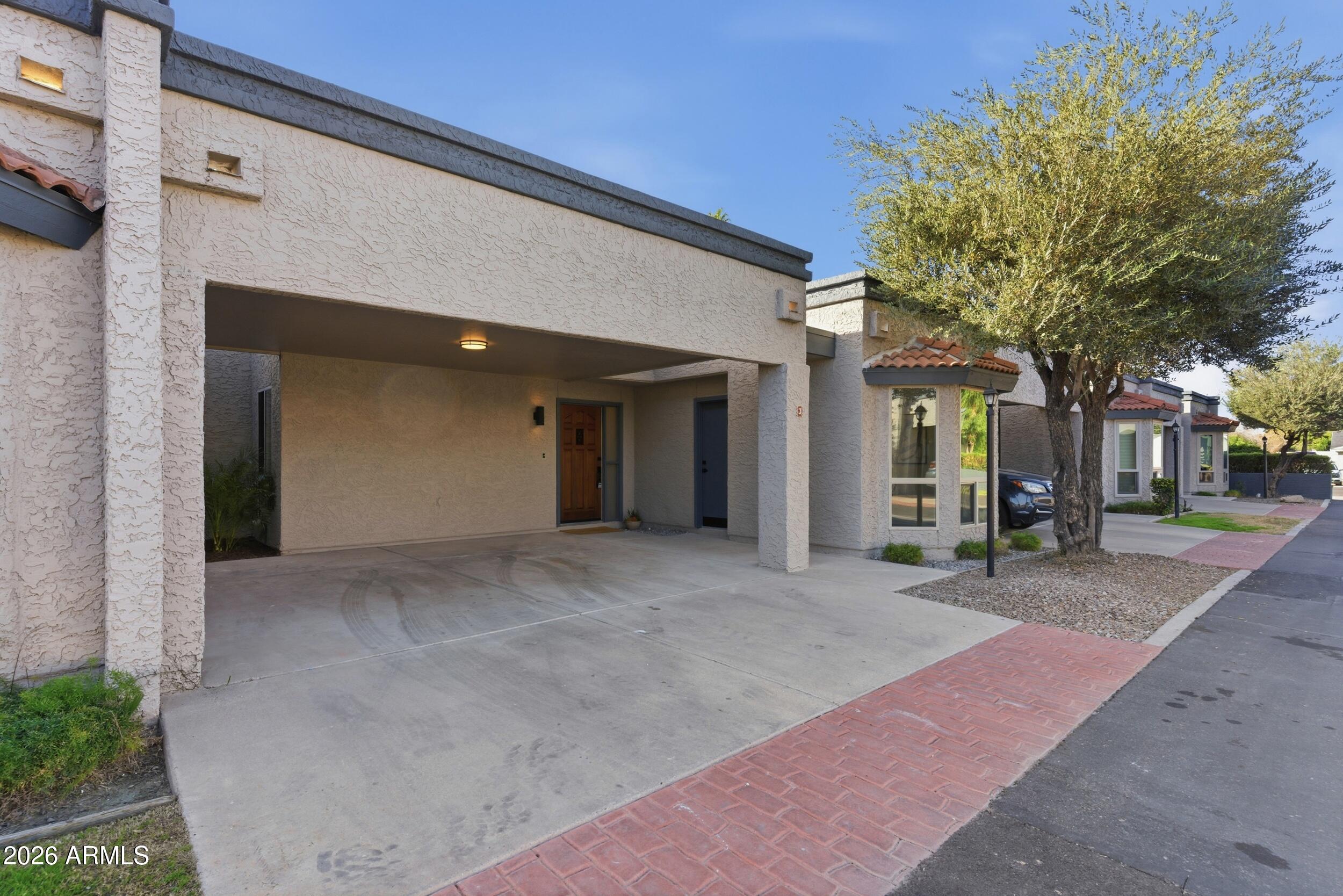 3415 North 36th Street, Unit 3 Phoenix, AZ 85018 - Photo 28 of 33 a view of a house with a backyard and a garage