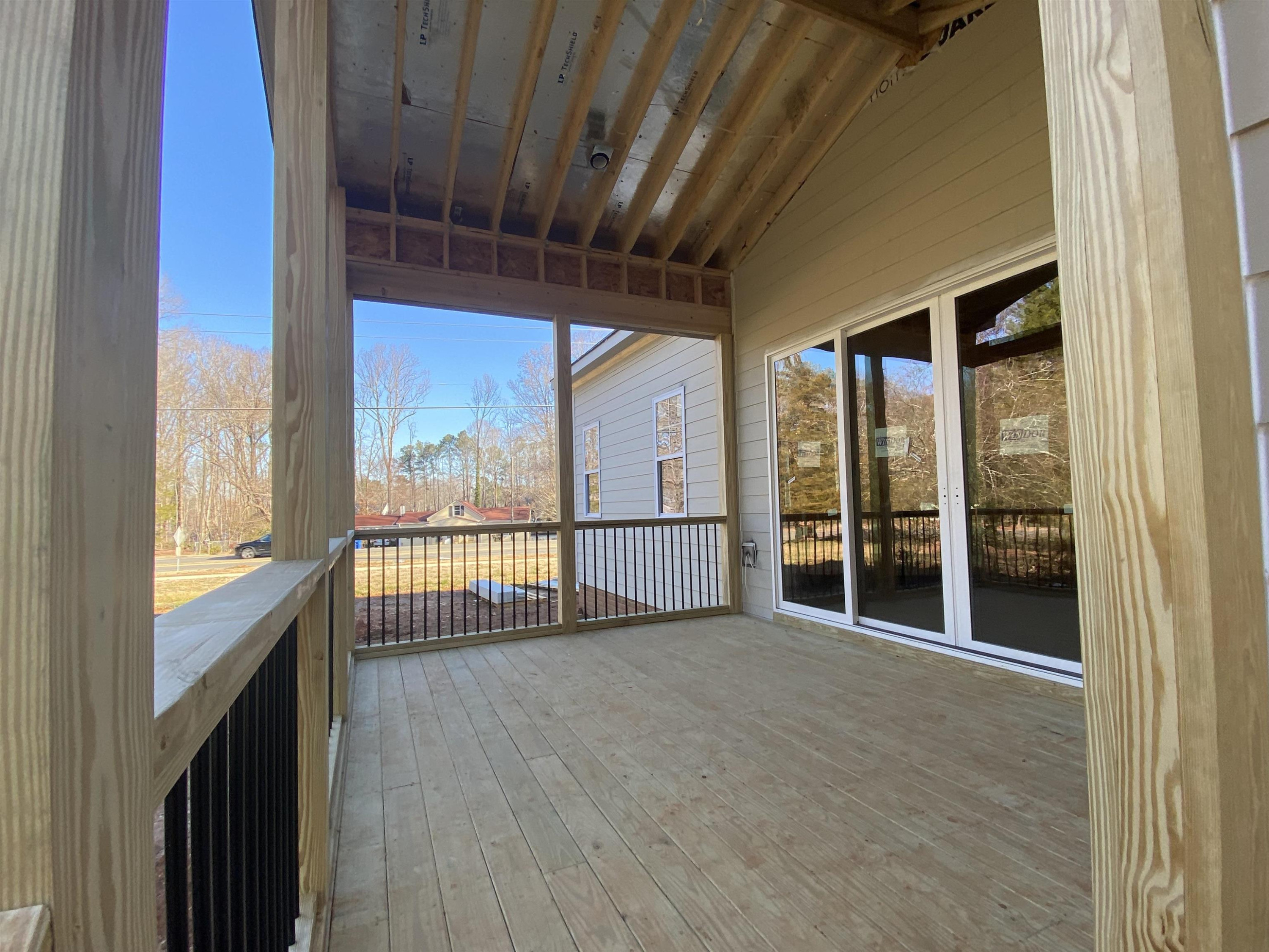 9121 Breeland Way Raleigh, NC 27613 - Photo 18 of 24 Easy access to the family room or breakfast nook from the screen porch. Screen Porch