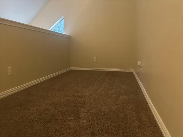 an empty room with a bench