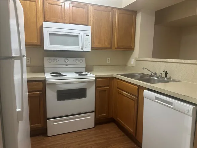 a kitchen with a stove and a microwave