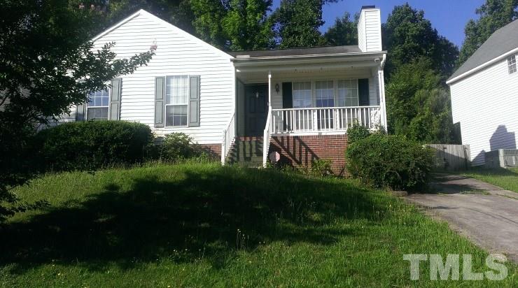 3909 Old Coach Road Raleigh, NC 27616 - Photo 1 of 10 a front view of a house with a yard and green space