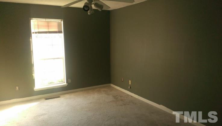 3909 Old Coach Road Raleigh, NC 27616 - Photo 7 of 10 an empty room with a window