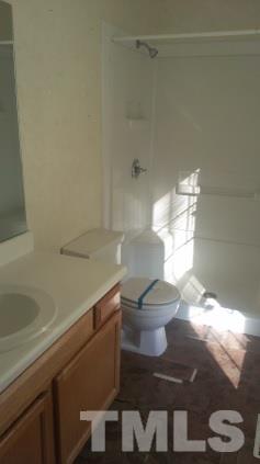3909 Old Coach Road Raleigh, NC 27616 - Photo 10 of 10 a bathroom with a toilet and a shower