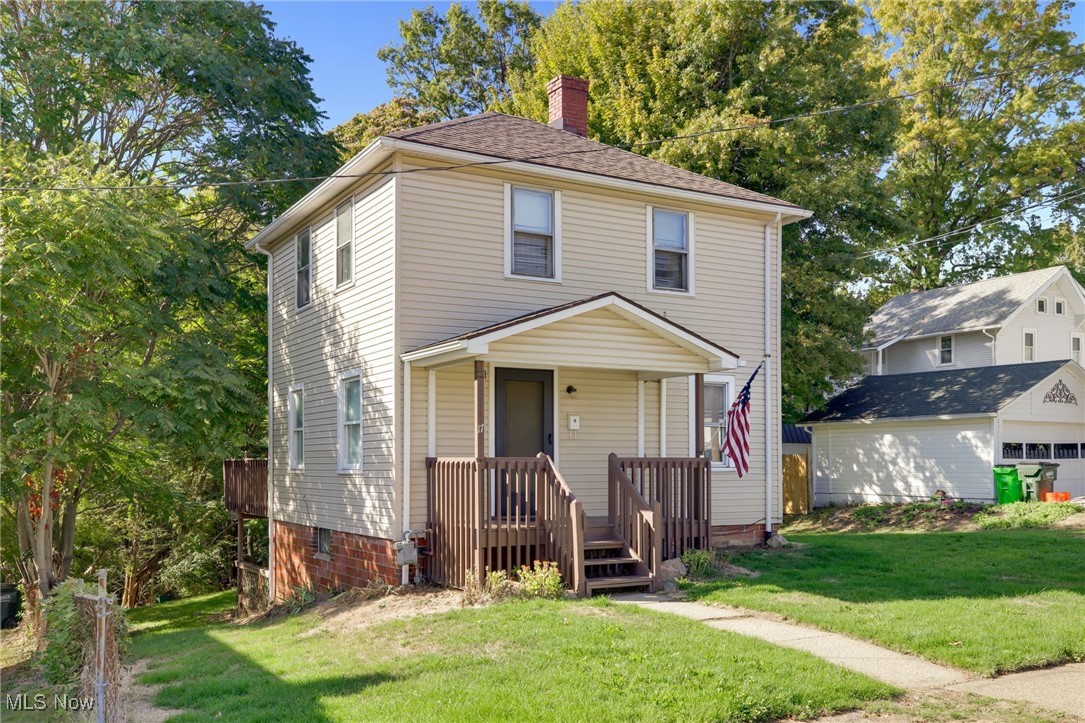 17 Ganyard Street Rittman, OH 44270 - Photo 16 of 16 View of front facade with a front lawn and a chimney