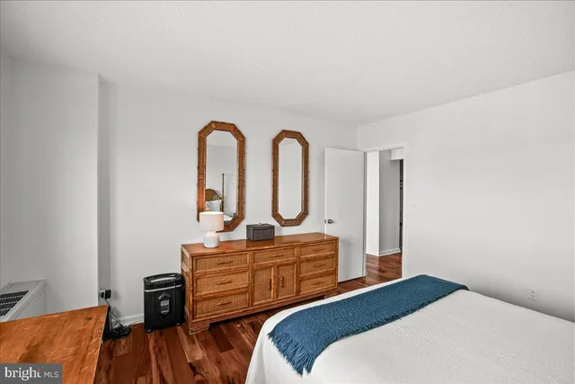 a bedroom with a bed and a dresser