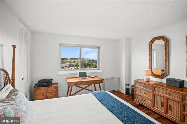 a bedroom with furniture and a window