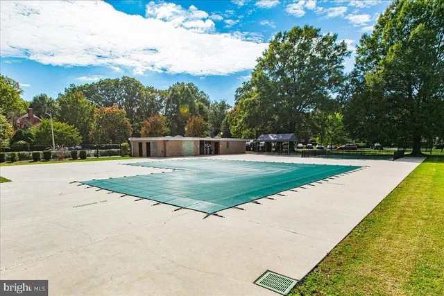 a view of swimming pool with a yard