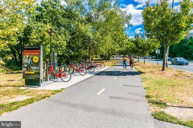 a view of a swimming pool with an outdoor seating