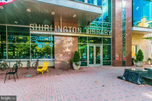 a view of a dinning room with chairs and table in front of the house
