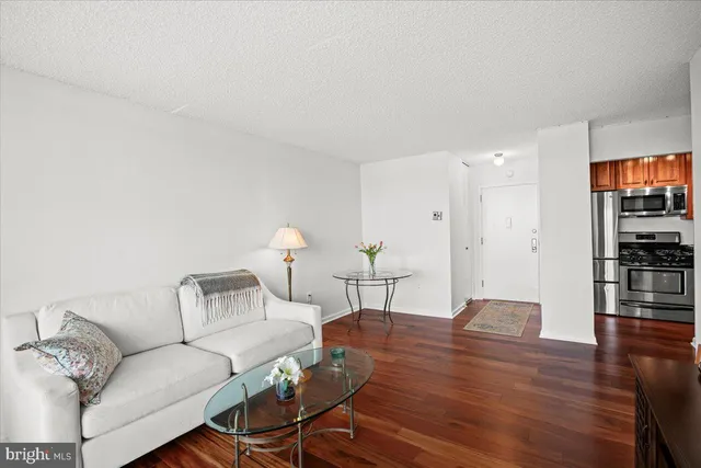 a living room with furniture and a table