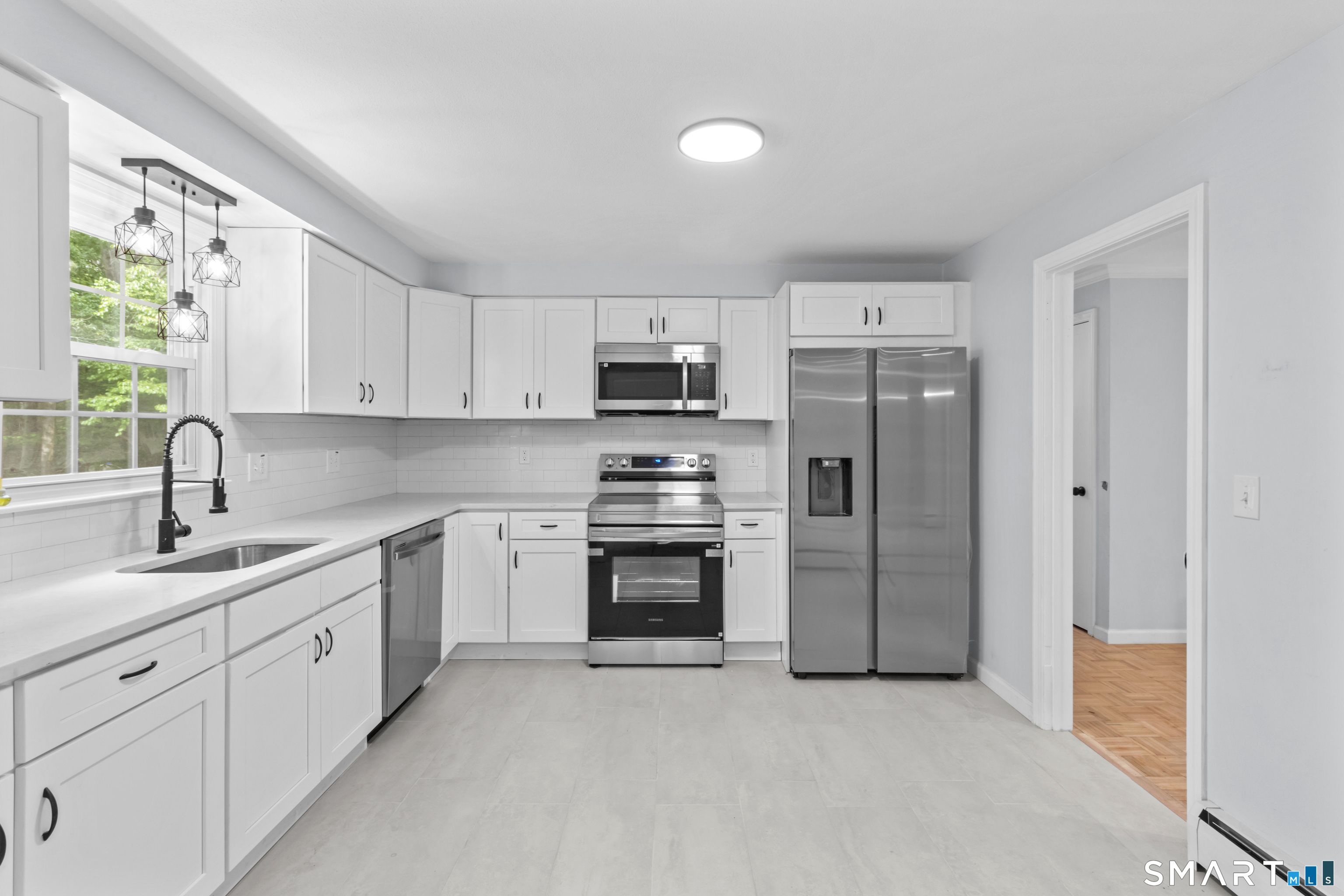 20 Quiet Woods Road East Hampton, CT 06424 - Photo 4 of 40 a kitchen with stainless steel appliances granite countertop a refrigerator and a stove top oven