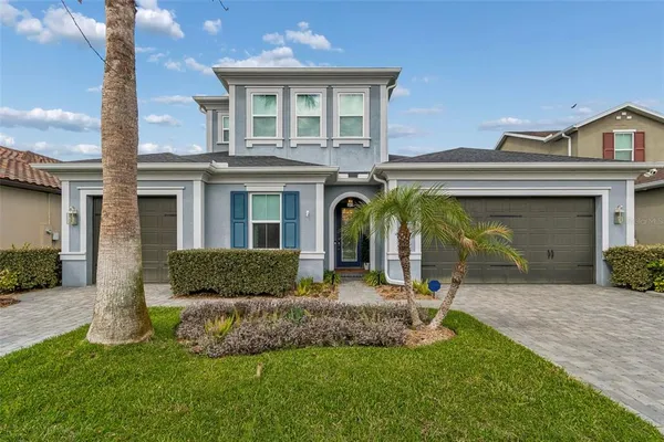 a view of a house with a yard