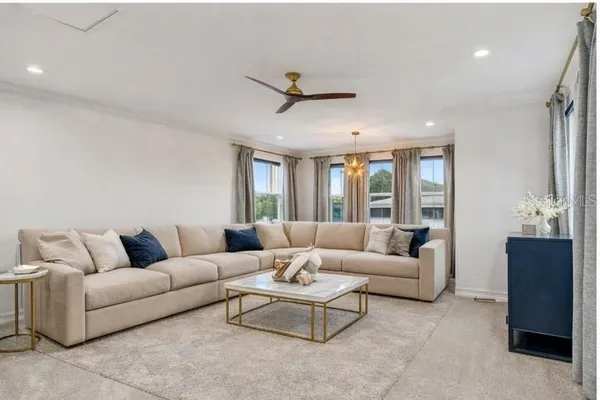 a living room with furniture and a large window