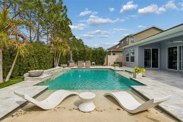 a view of a swimming pool with a patio