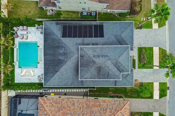 an aerial view of a house with a garden