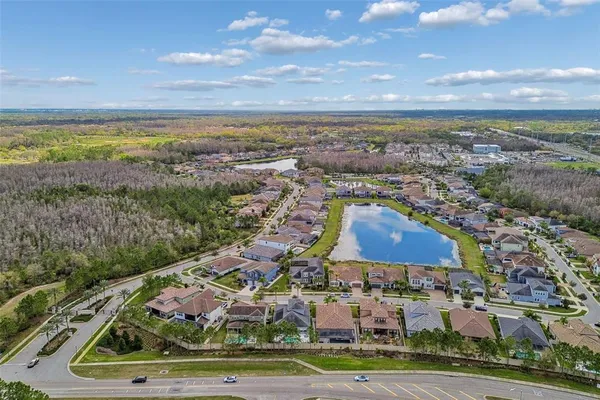 an aerial view of residential building and lake
