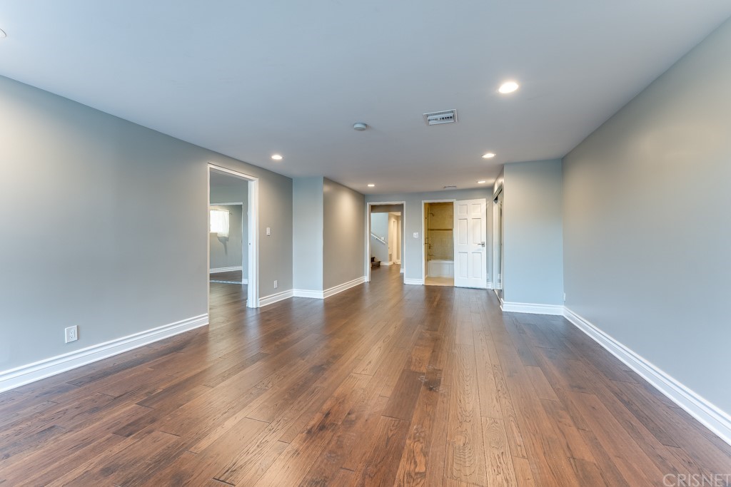 150 Saddlebow Road Bell Canyon, CA 91307 - Photo 12 of 37 a view of an empty room with wooden floor