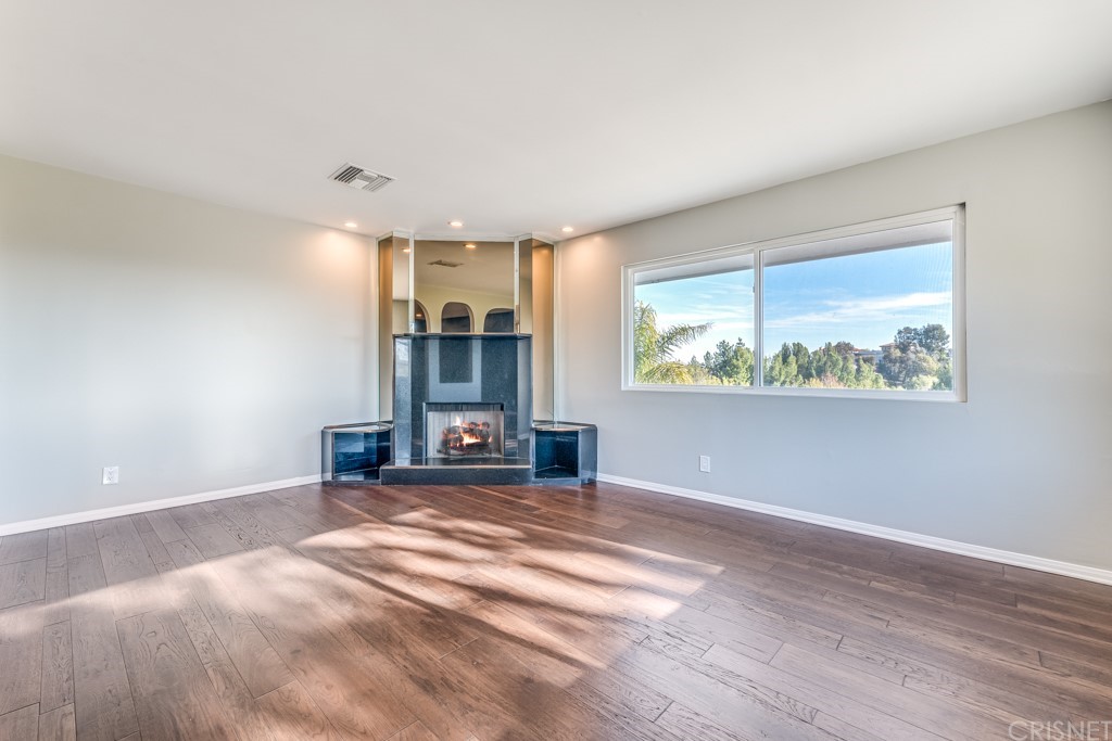 150 Saddlebow Road Bell Canyon, CA 91307 - Photo 22 of 37 a view of an empty room with window and a kitchen