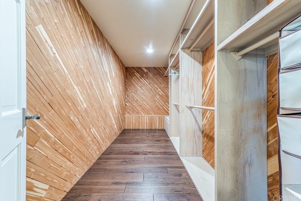 150 Saddlebow Road Bell Canyon, CA 91307 - Photo 24 of 37 a view of a hallway with wooden floor and staircase