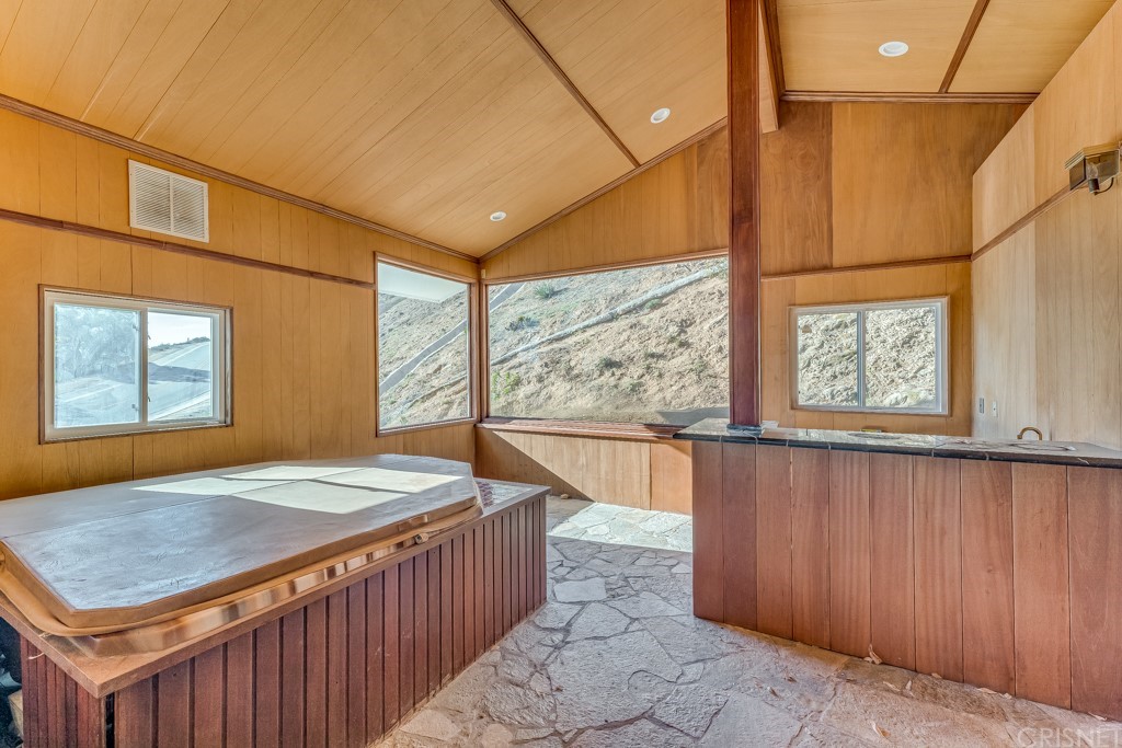 150 Saddlebow Road Bell Canyon, CA 91307 - Photo 25 of 37 a bedroom with a bed and window