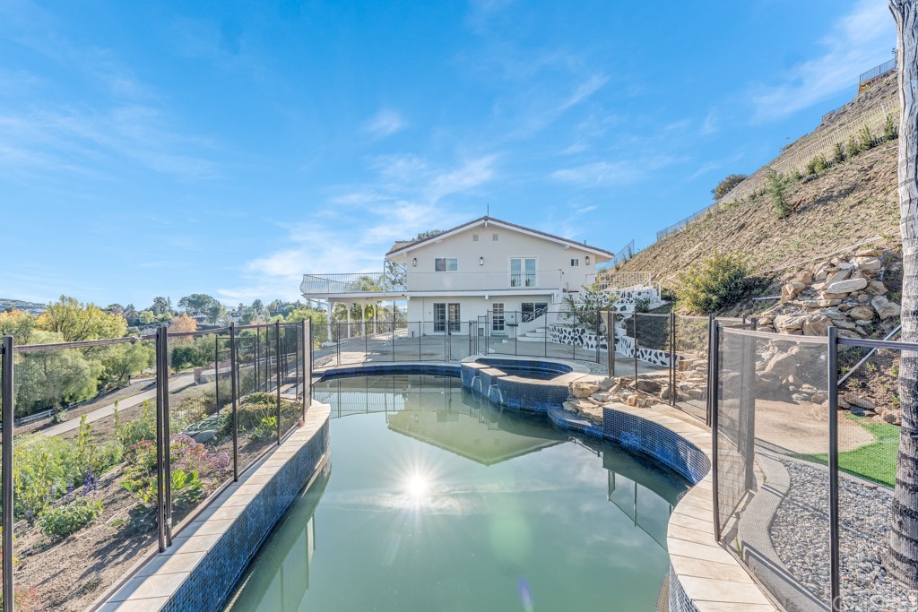 150 Saddlebow Road Bell Canyon, CA 91307 - Photo 29 of 37 a view of a swimming pool with a patio