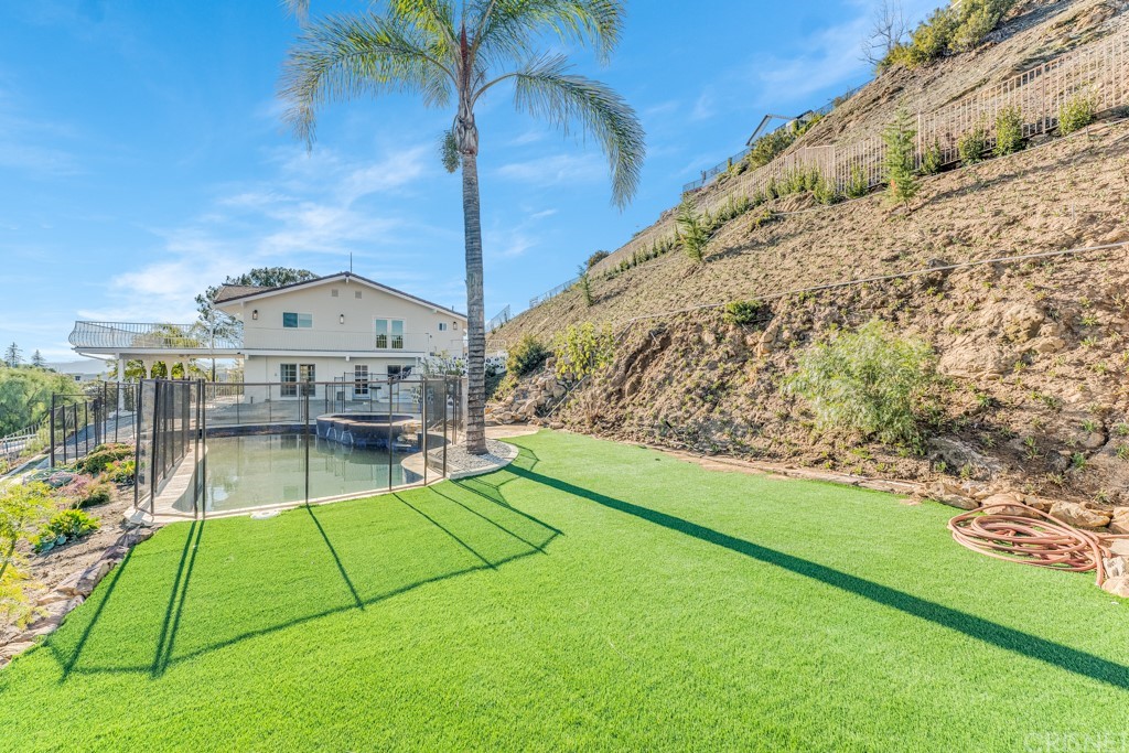 150 Saddlebow Road Bell Canyon, CA 91307 - Photo 31 of 37 a view of a swimming pool with a yard