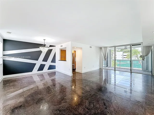 a view of an empty room with stairs