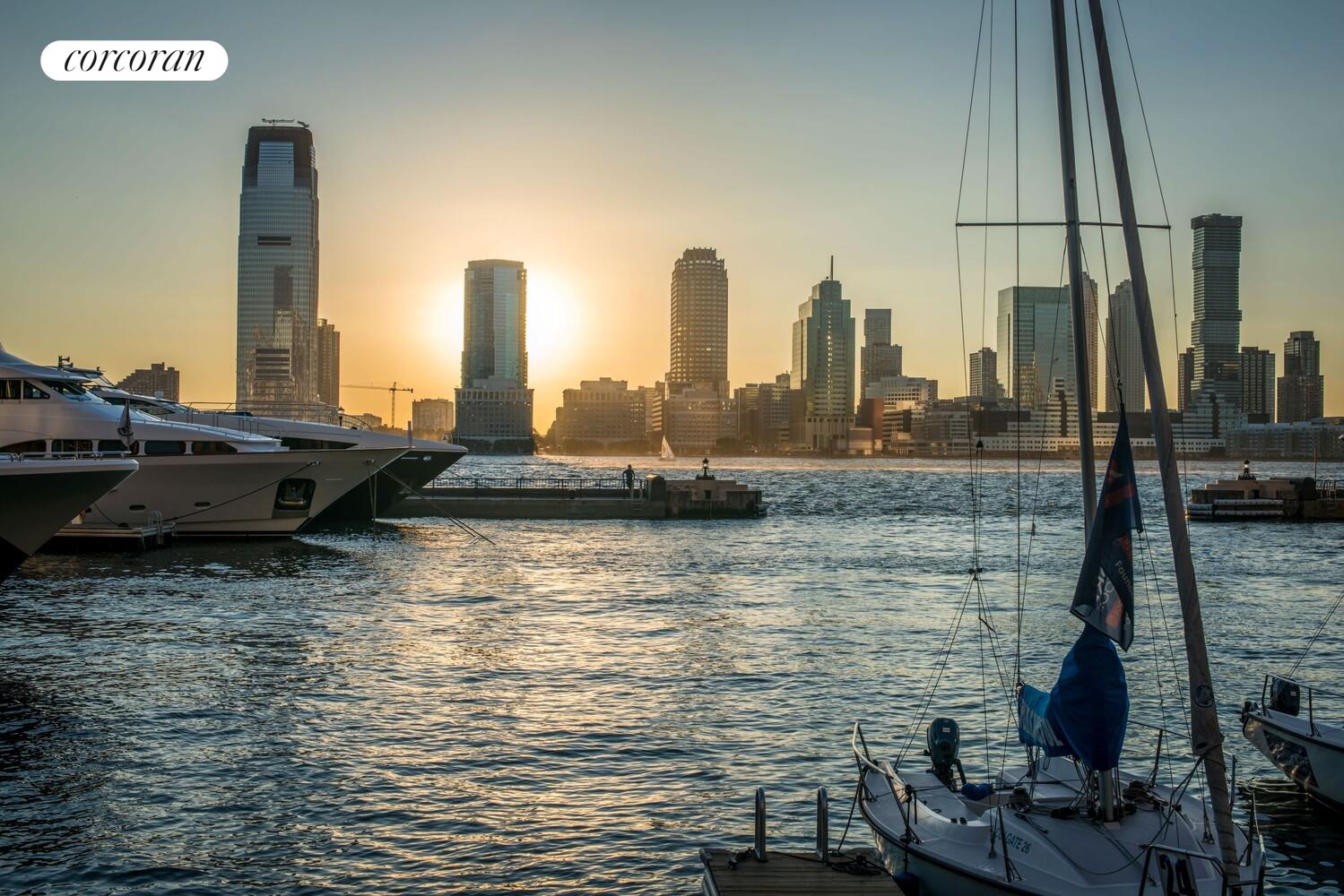 380 Rector Place, Unit 14G Manhattan, NY 10280 - Photo 11 of 12 a view of a ocean with boats in the ocean