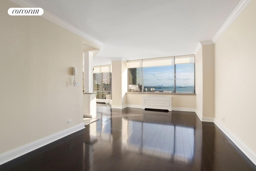380 Rector Place, Unit 14G Manhattan, NY 10280 - Photo 4 of 12 a view of living room with a large window