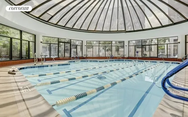 a bathroom with a sink vanity mirror and toilet