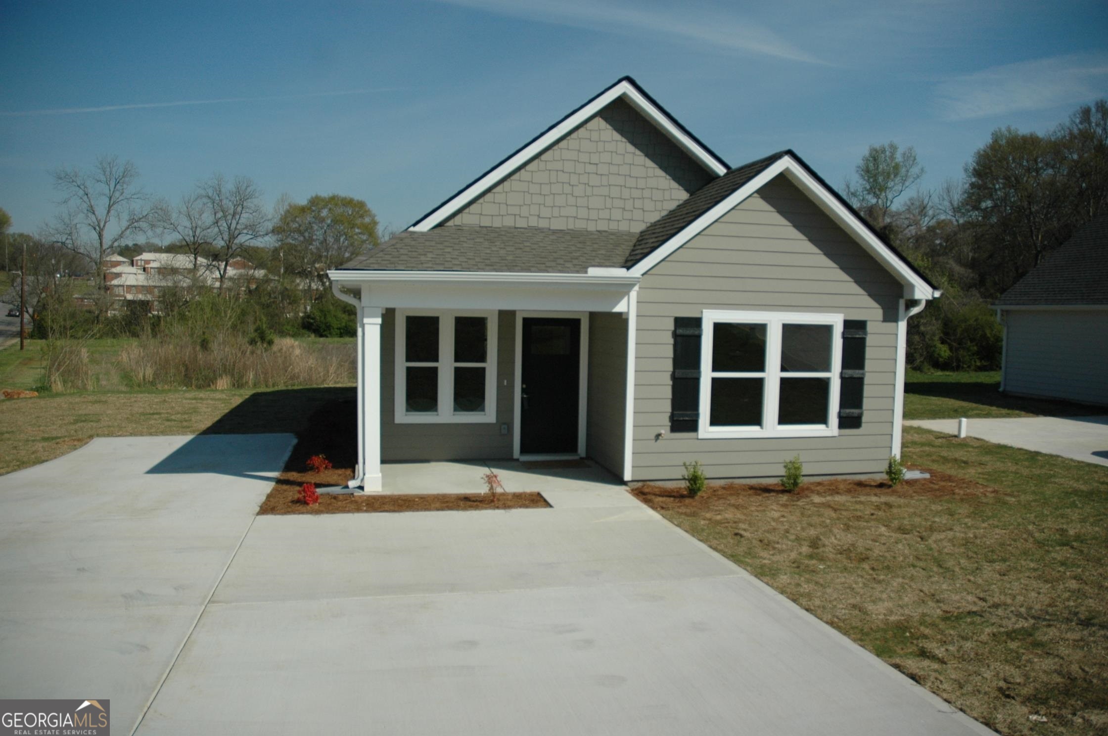 1045 Polk Street LaGrange, GA 30240 - Photo 1 of 1 a front view of a house with a yard