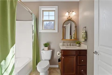 a kitchen with stainless steel appliances granite countertop a sink a stove and cabinets