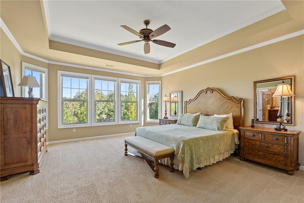 319 Laurel Lookout Hills Canton, GA 30114 - Photo 28 of 80 a spacious bedroom with a bed and a large window