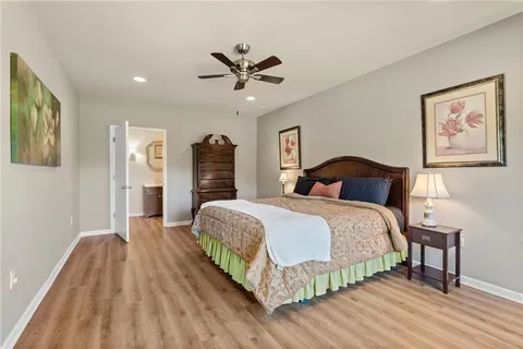 a balcony with wooden floor and fence