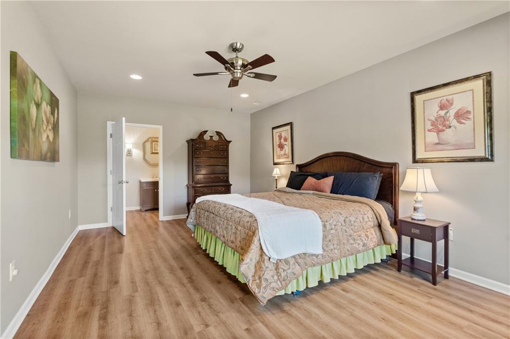 319 Laurel Lookout Hills Canton, GA 30114 - Photo 36 of 80 a bedroom with a bed and a chandelier