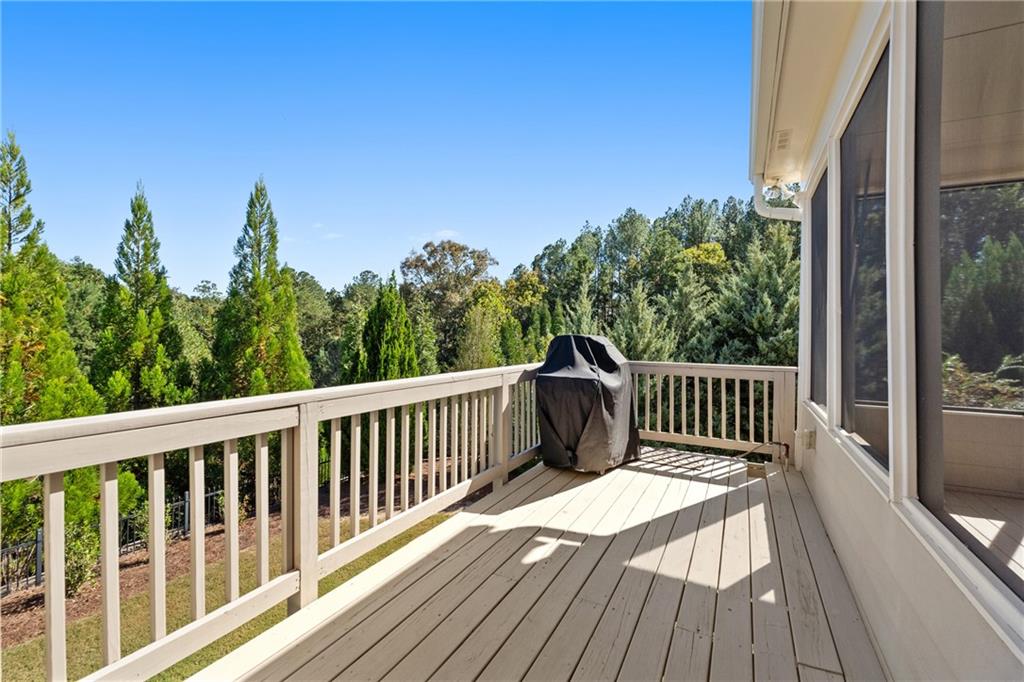 319 Laurel Lookout Hills Canton, GA 30114 - Photo 48 of 80 a balcony with wooden floor and fence