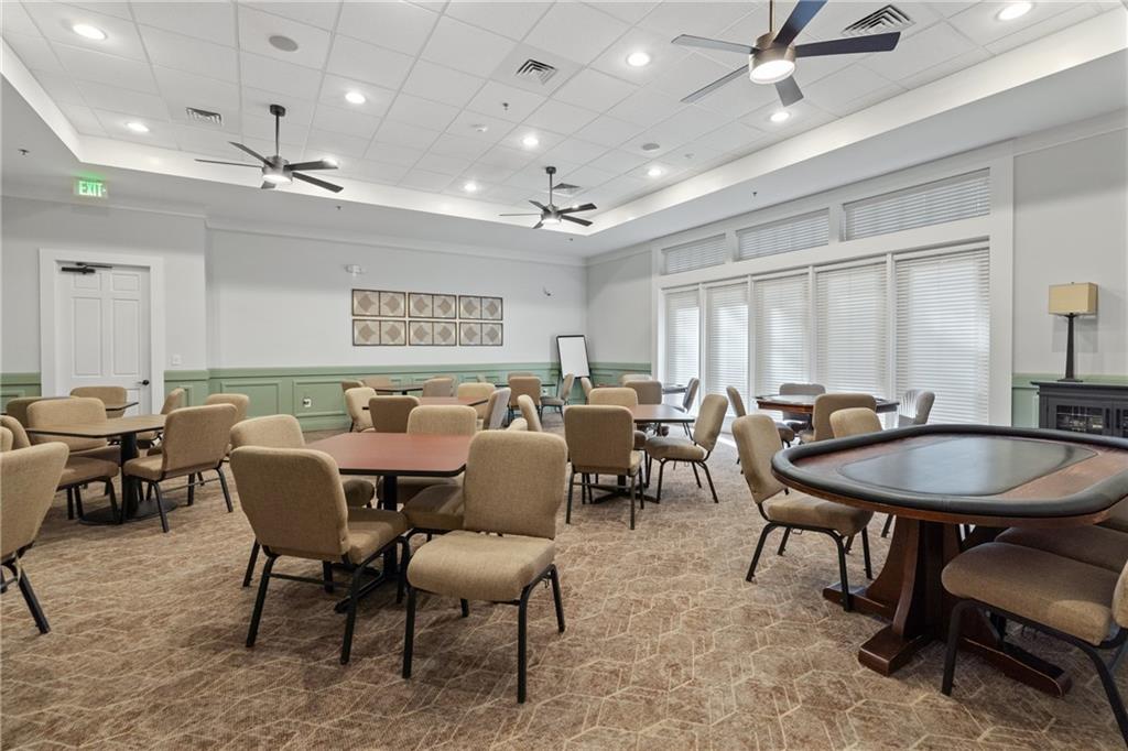319 Laurel Lookout Hills Canton, GA 30114 - Photo 63 of 80 a living room with lots of furniture a rug and a chandelier