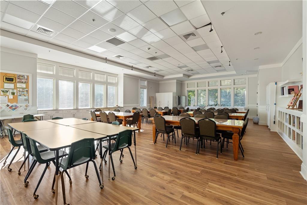 319 Laurel Lookout Hills Canton, GA 30114 - Photo 64 of 80 a view of a dining room with furniture window and wooden floor