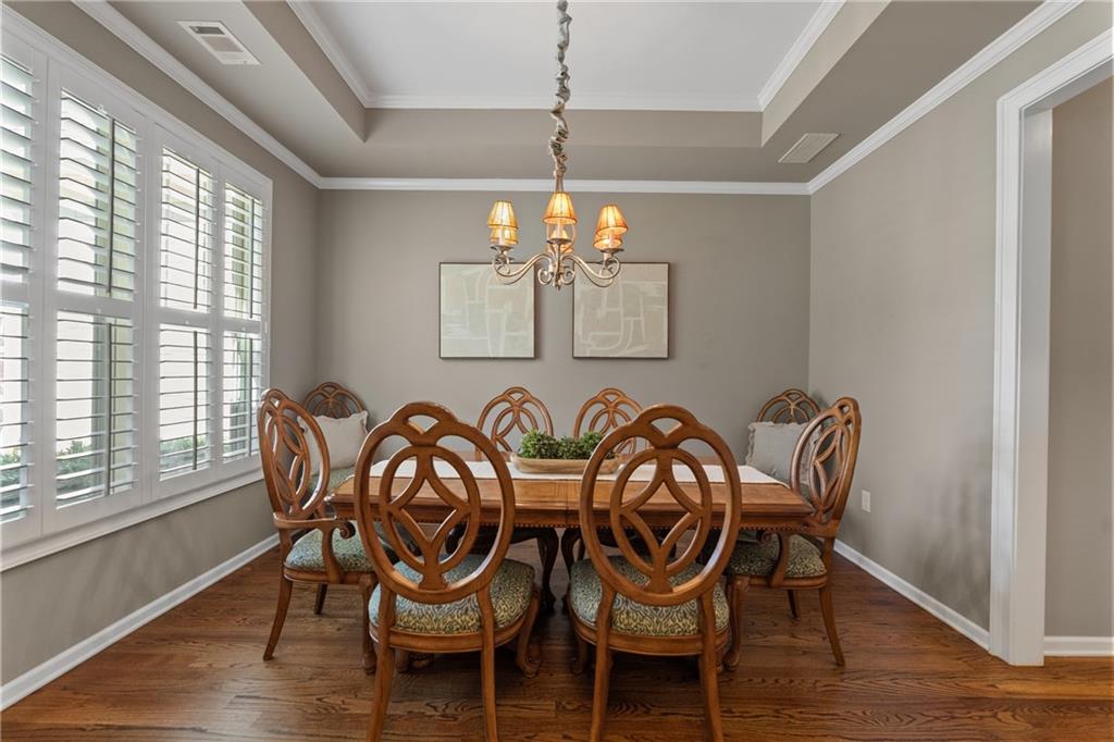 319 Laurel Lookout Hills Canton, GA 30114 - Photo 10 of 80 a view of a dining room with furniture wooden floor and chandelier