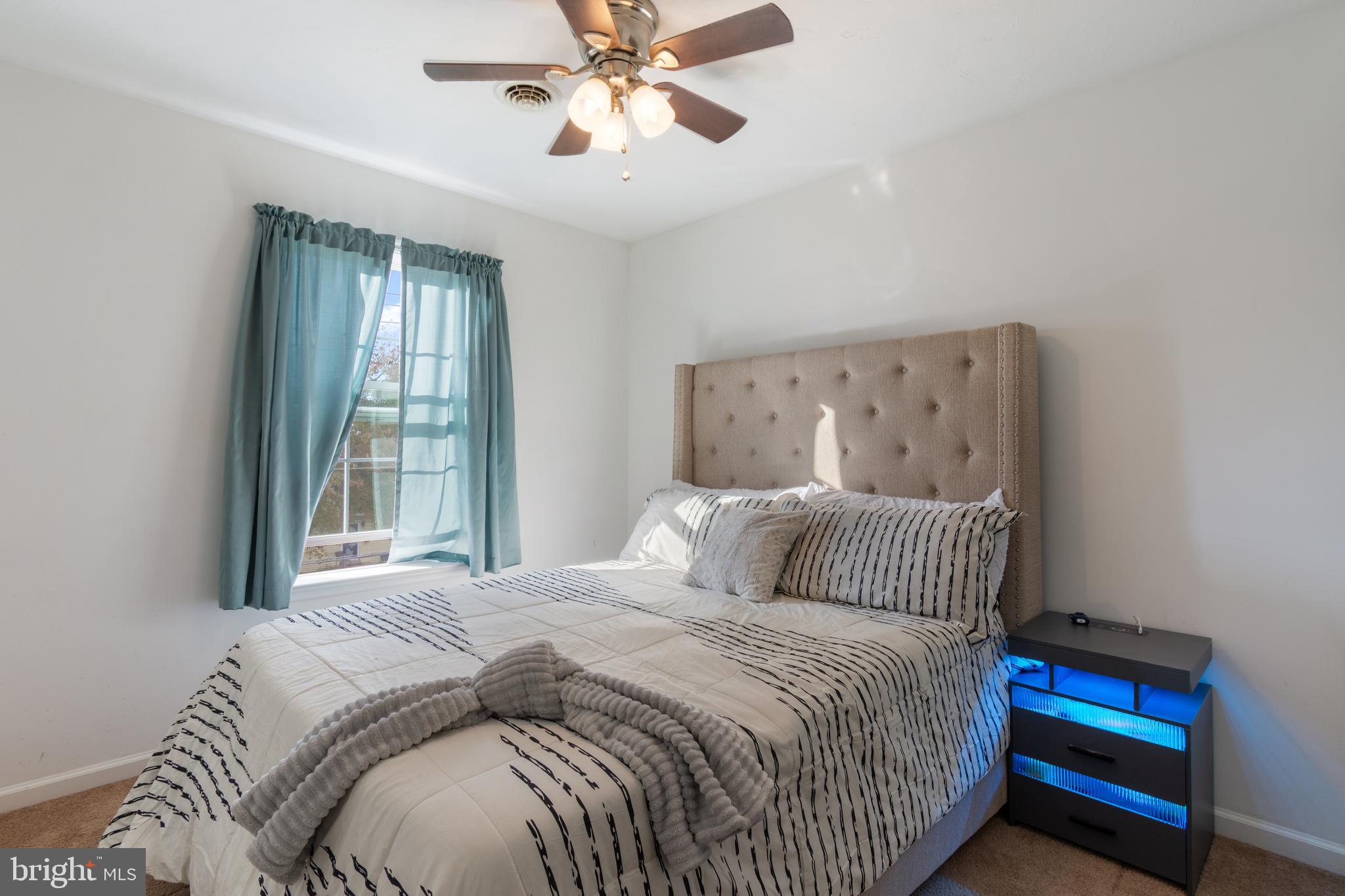 191 Moul Avenue Hanover, PA 17331 - Photo 29 of 49 a bedroom with a large bed and a chandelier