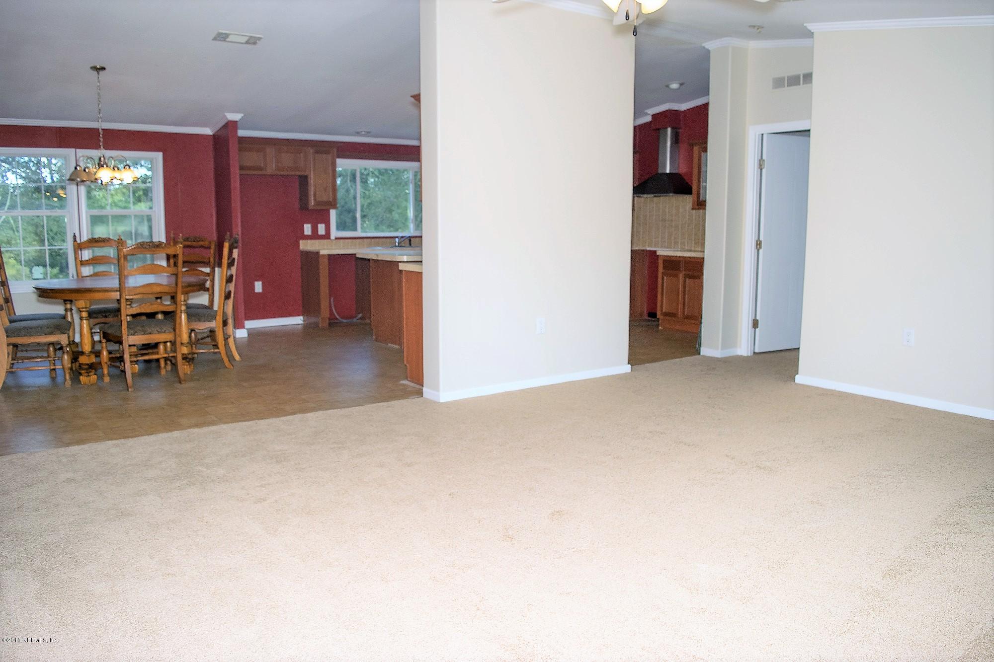 1933 Rose Ridge Court Middleburg, FL 32068 - Photo 6 of 27 Living Room Kitchen