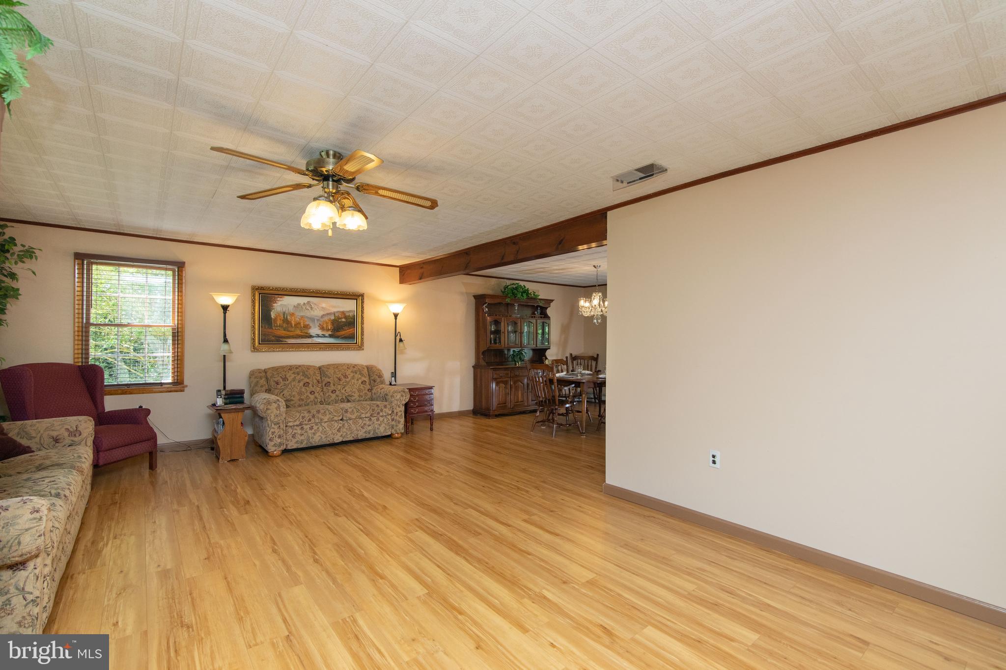 741 Heritage Road Sewell, NJ 08080 - Photo 11 of 60 a view of a livingroom with furniture and a flat screen tv