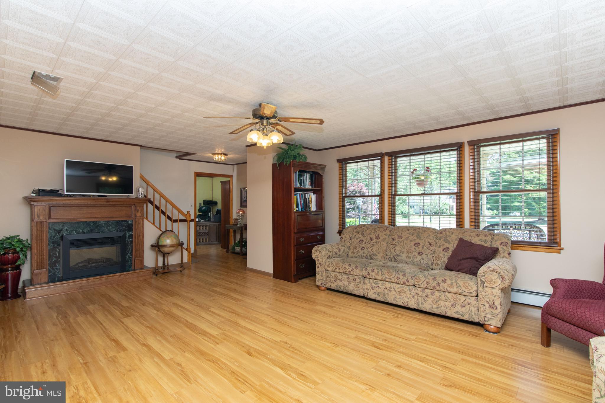 741 Heritage Road Sewell, NJ 08080 - Photo 13 of 60 a living room with furniture and a fireplace