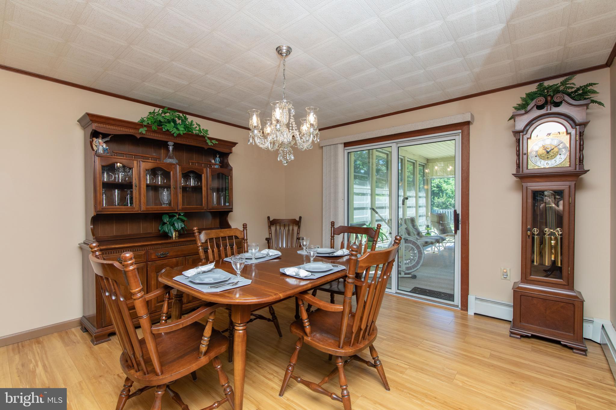 741 Heritage Road Sewell, NJ 08080 - Photo 15 of 60 a view of a dining room with furniture window and wooden floor