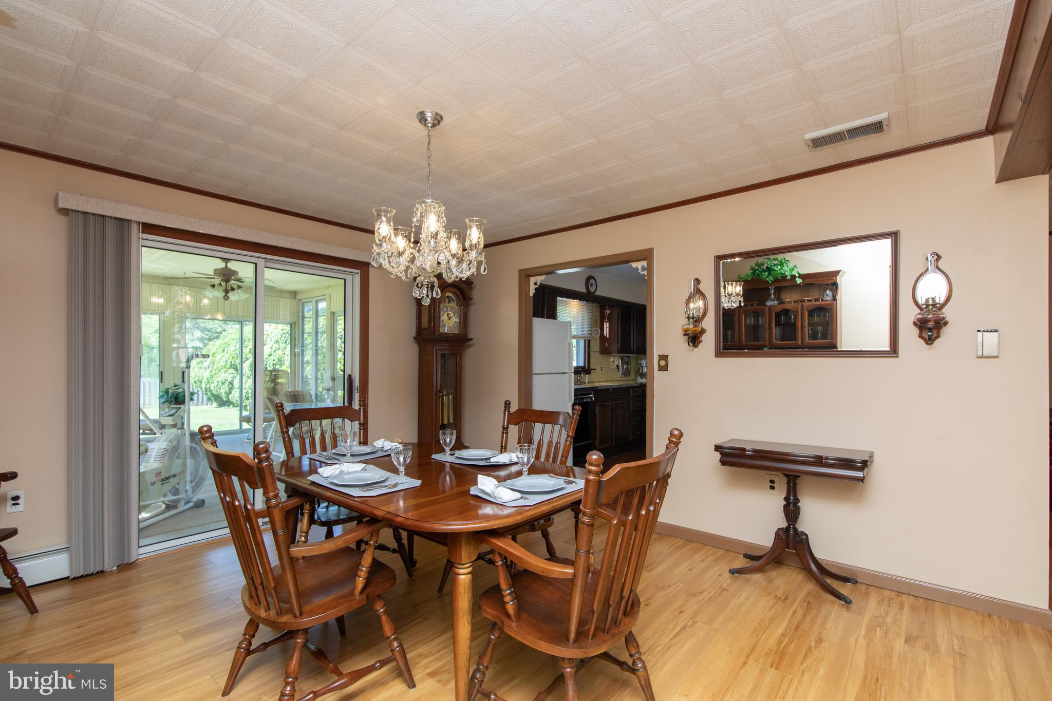 741 Heritage Road Sewell, NJ 08080 - Photo 16 of 60 a view of a dining room with furniture window and wooden floor