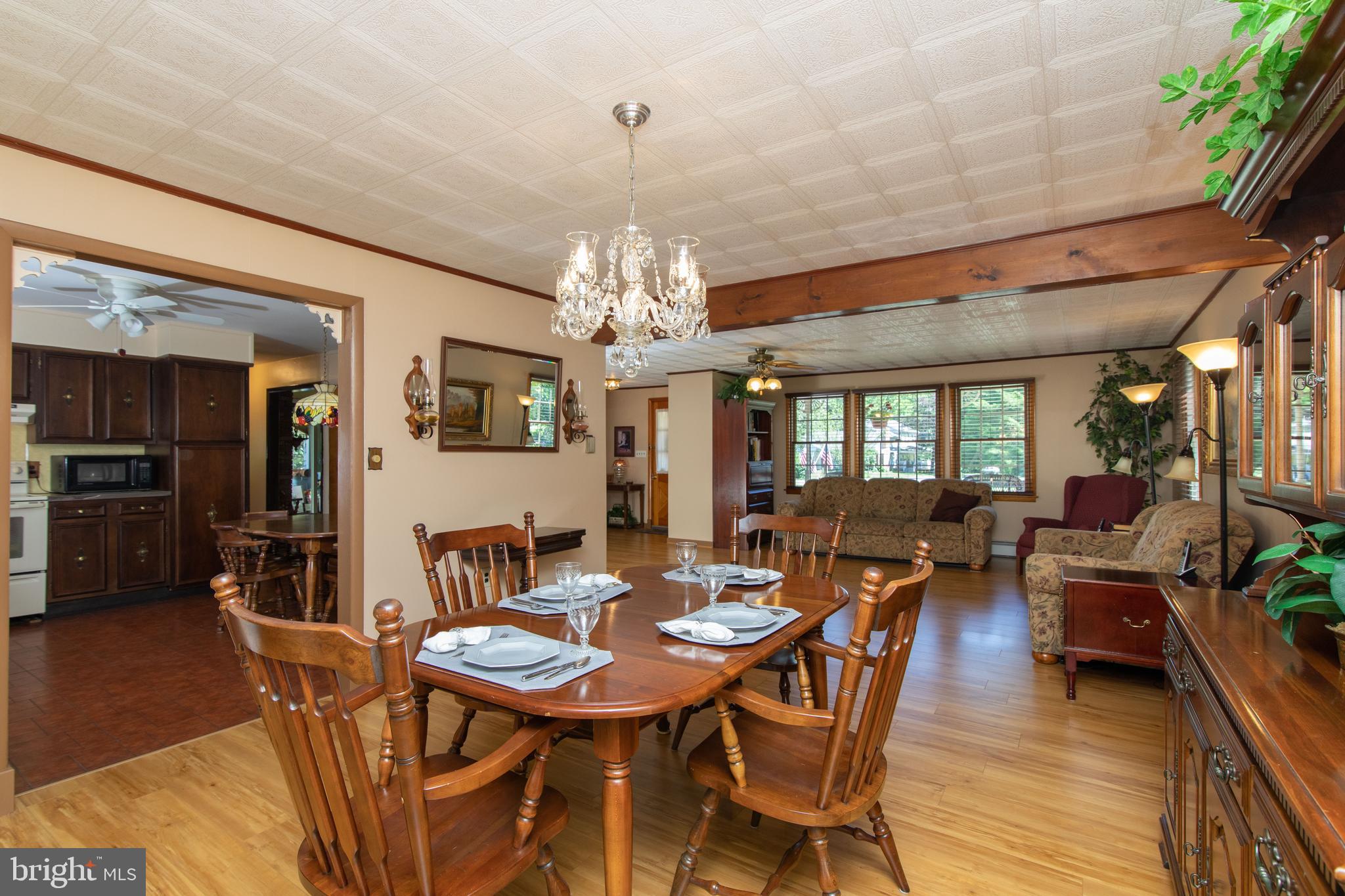 741 Heritage Road Sewell, NJ 08080 - Photo 17 of 60 a view of a dining room with furniture window and wooden floor