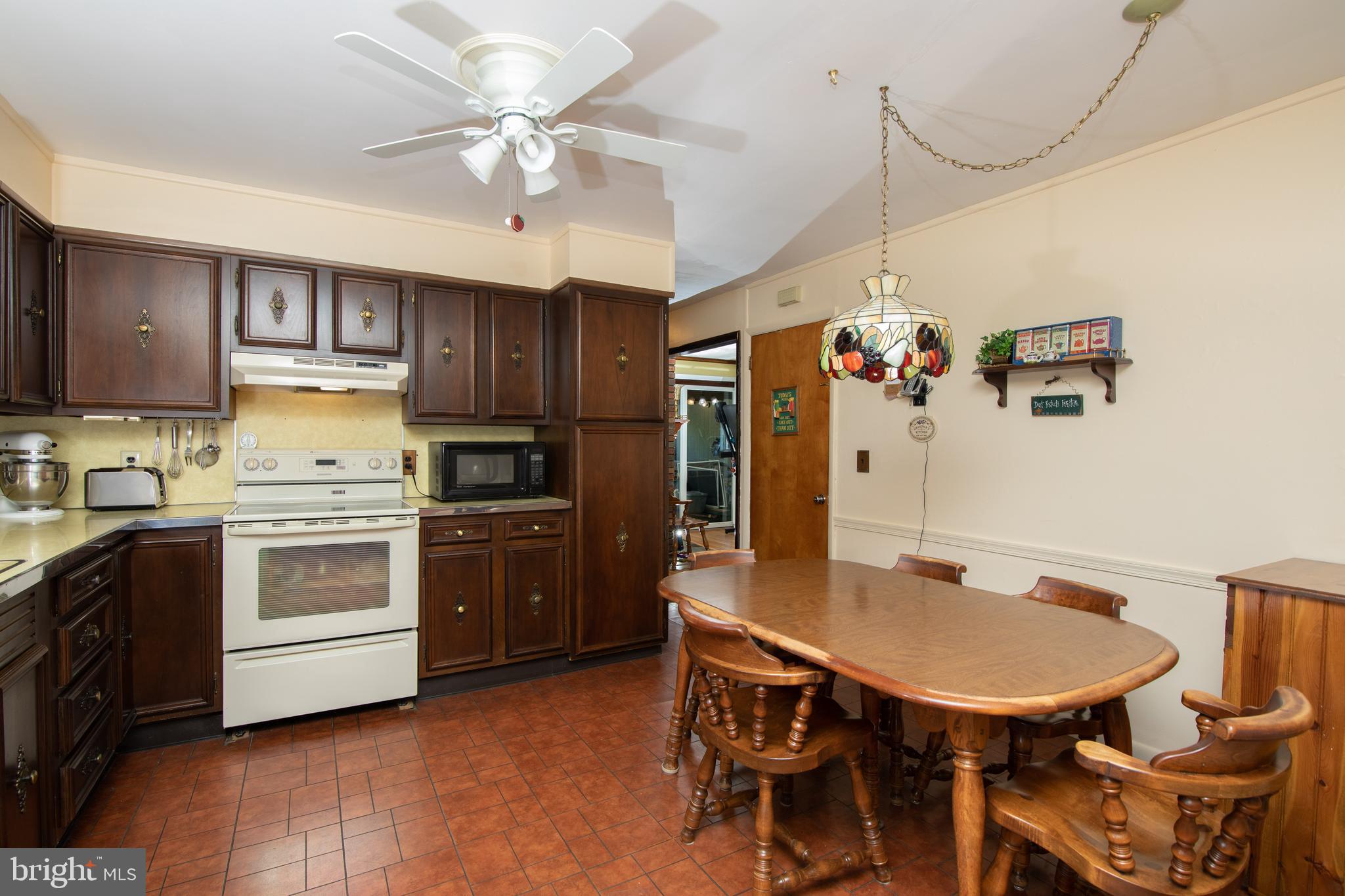 741 Heritage Road Sewell, NJ 08080 - Photo 19 of 60 a kitchen with stainless steel appliances a stove a refrigerator and a dining table