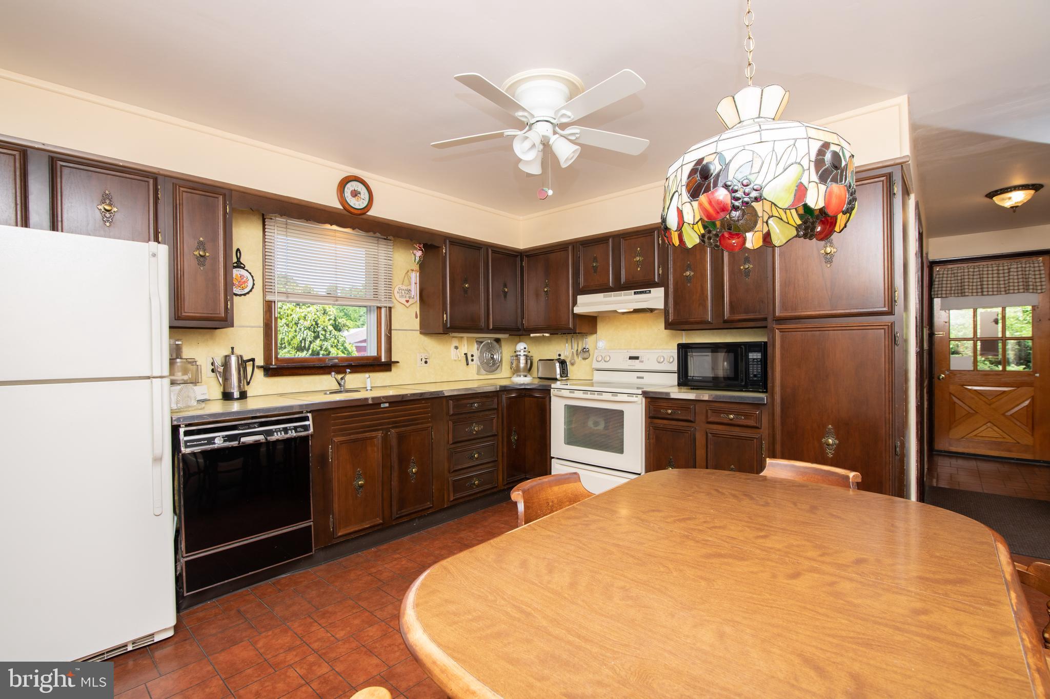 741 Heritage Road Sewell, NJ 08080 - Photo 22 of 60 a kitchen with kitchen island granite countertop a sink stainless steel appliances and refrigerator
